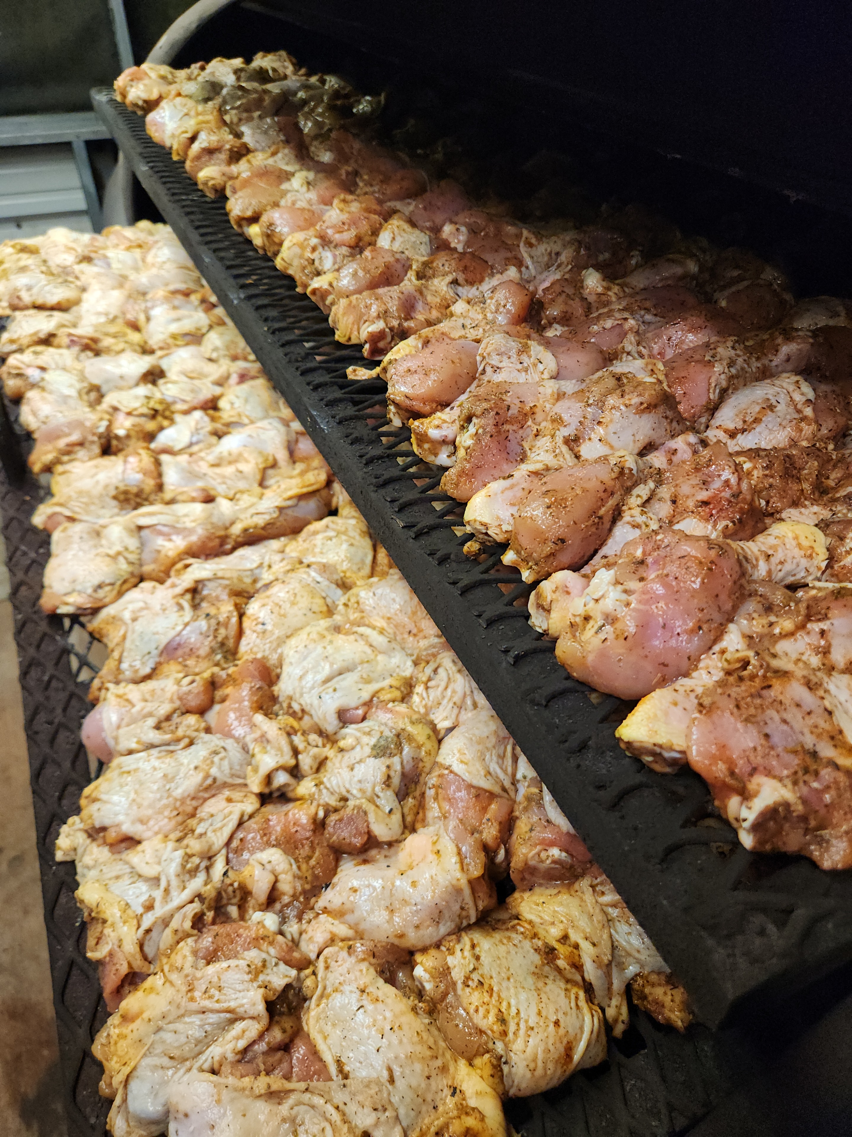 Seasoned chicken prepared for community meal service