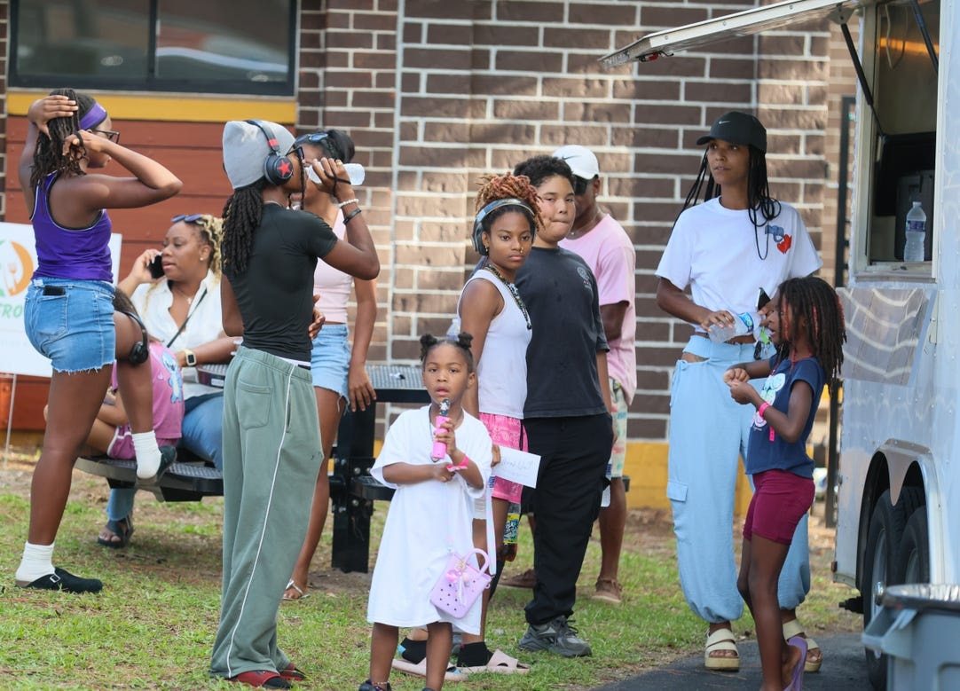 Community members gathered at an outdoor Grassroots event