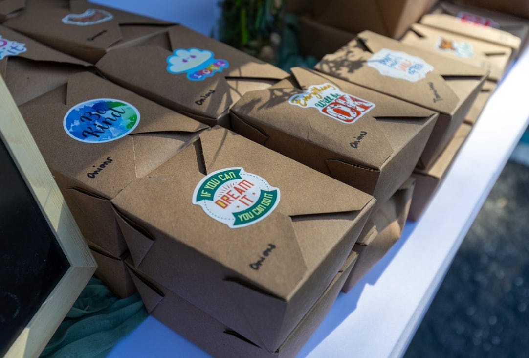 Branded meal boxes ready for community distribution