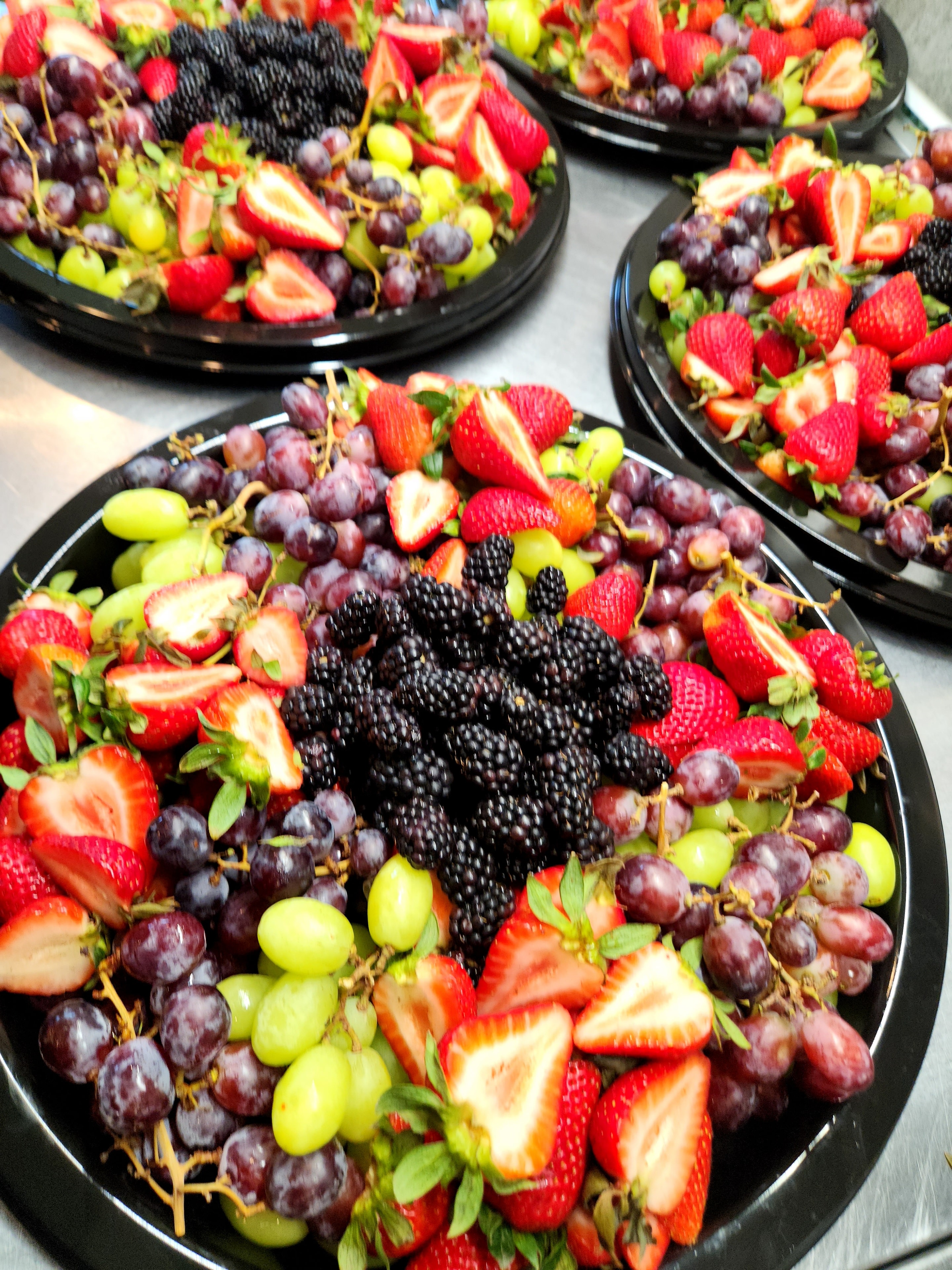 Fresh berry platters — strawberries, blackberries, grapes